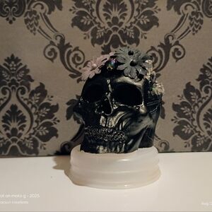 Decorative Black Skull with Floral Accents